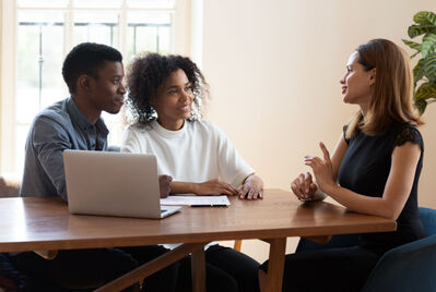 Three people having a meeting 